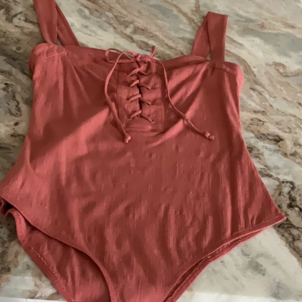 Free People lace up bodysuit, sleeveless, terracotta color, size large